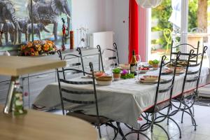 a dining room with a table with food on it at "Logis Debussy"- Saintes in Saintes