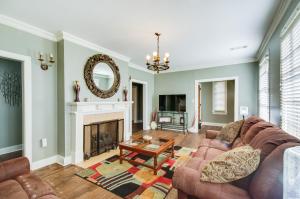 a living room with a couch and a fireplace at Cozy Jackson Vacation Rental Less Than 1 Mi to University in Jackson