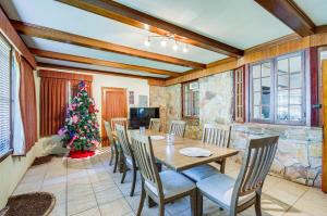 a dining room with a table and a christmas tree at Cozy Jackson Vacation Rental Less Than 1 Mi to University in Jackson