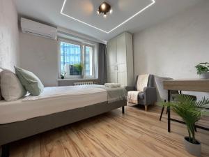 Krevet ili kreveti u jedinici u okviru objekta Emilii Plater 55 - Modern Full Apartment