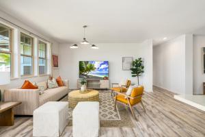 a living room with a couch and chairs at @ Marbella Lane - 3BR w/ Phenomenal Ocean+MT views in Waianae
