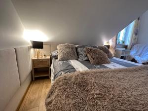 Posteľ alebo postele v izbe v ubytovaní Comfort Zone Ostroda BOHO SCANDI
