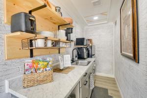 a kitchen with a sink and a counter top at Adorable Studio about 1 Mi to Cherry Grove Beach! in Myrtle Beach
