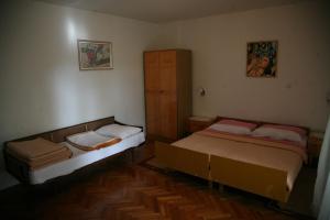 Postel nebo postele na pokoji v ubytování Nada Apartments