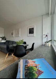 a living room with a couch and a table at SEASIDE APARTMENT in Liepāja