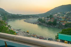 a view of a river with buildings and a city at Madpackers Rishikesh 2-0 in Rishīkesh
