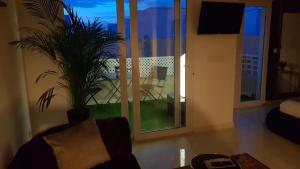Apartamento Pepi Puerto (Adults Only)的电视和/或娱乐中心