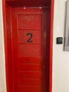 a red door with the number two on it at Rostelbem Guesthouse Lisbon in Lisbon