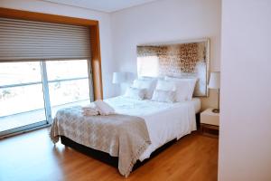 Postel nebo postele na pokoji v ubytování Casa Lima Braga