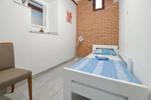 Postel nebo postele na pokoji v ubytování Apartments Smoky