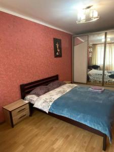 Posteľ alebo postele v izbe v ubytovaní Apartment in Shoduar's park