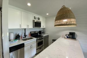 a kitchen with a sink and a stove top oven at Bluff Villas 1807 in Hilton Head Island