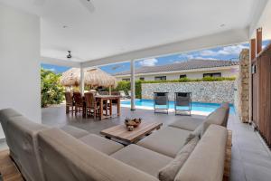 a living room with a couch and a table at Grand Windsock Bonaire in Kralendijk