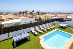 an image of a pool on the roof of a house at Villa Caleta Heights by Villa Plus in Caleta De Fuste