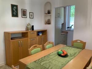a kitchen with a table with a bowl of fruit on it at Bonaca in Izola
