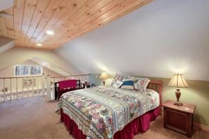 a bedroom with a bed in a attic at Mountain Abbey in Beech Mountain