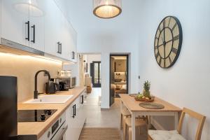 a kitchen with a sink and a counter top at 23 Smart Suite by The Villa Collector in Imerovigli