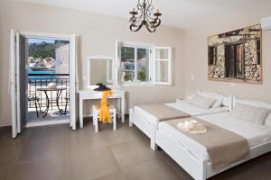A bed or beds in a room at Poseidon Hotel