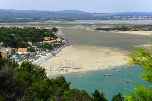an aerial view of a beach with boats in the water at la Luna in Lapalme