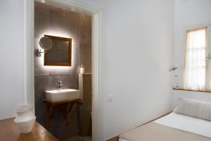 A bed or beds in a room at Poseidon Hotel