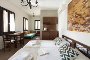 A bed or beds in a room at Poseidon Hotel