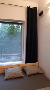 a window in a room with two pillows in front at Apartament Klimt 1 in Bielsko-Biala