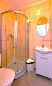 a bathroom with a shower and a sink at Central Station Hostel in Warsaw