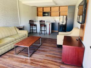 a living room with a couch and a table at North Villa extended stay in Houston
