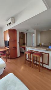 a room with a kitchen and a living room at New Life Piracicaba by Atlantica in Piracicaba