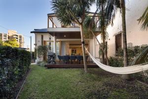 a hammock in the backyard of a house at Beach Retreat in Sydney