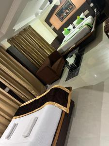 a bedroom with two beds and a bedskirts at Sky Pie hotel in Dharamshala