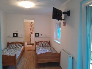 Postel nebo postele na pokoji v ubytování Vörösmarty Apartman