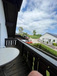 a balcony with a table and a view of a street at Mira Home in Murg +7 photos