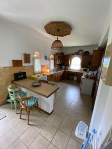 a kitchen with a table and chairs in a room at Elia House in Vatopedi