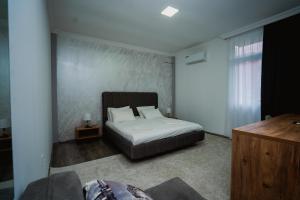 Tempat tidur dalam kamar di Nica