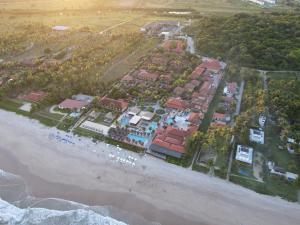 an aerial view of a resort on the beach at Ocaporã Hotel All Inclusive in Porto De Galinhas