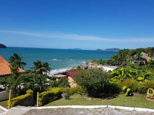 a view of the ocean from a house at Secret Spot Floripa in Florianópolis