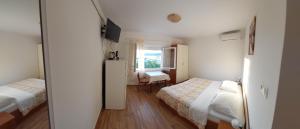 Posteľ alebo postele v izbe v ubytovaní Gvačić House