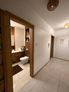 Kúpeľňa v ubytovaní Comfort Zone Ostroda BOHO SCANDI
