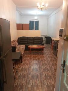 a living room with a couch and a table at STUDIO BASSE CASBAH in Kasbah