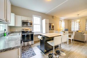 a kitchen and living room with a table and chairs at Wilmington Getaway Near Riverwalk and Downtown! in Wilmington
