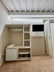 TV a/nebo společenská místnost v ubytování B&B La Fenice