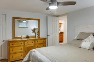 a bedroom with a bed and a mirror on a dresser at Quakertown Vacation Rental Close to Hiking Trails in Quakertown