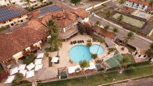 an overhead view of a house with two swimming pools at Hotel Solar in Salinópolis