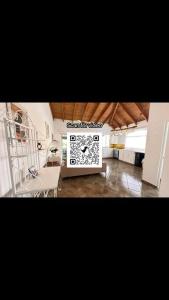 a living room with a sink and a table at Central Cabarete Apartment in Cabarete