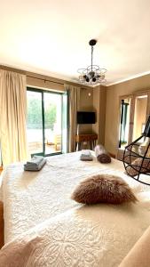 a bedroom with a large bed with a furry pillow on it at Villa Muraj-Kornić, Krk in Kornić +28 photos