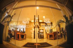 a store front with a large glass window at Garda Hotel in Laranjeiras do Sul