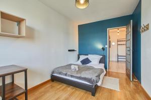 Posteľ alebo postele v izbe v ubytovaní Appartement avec belle vue dégagée du 11e étage