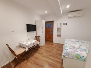 Postel nebo postele na pokoji v ubytování Meressa Nina&Leo Studio Apartments