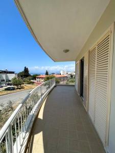 a balcony of a building with a view of a street at Somos Flats Kuşadası in Kusadası